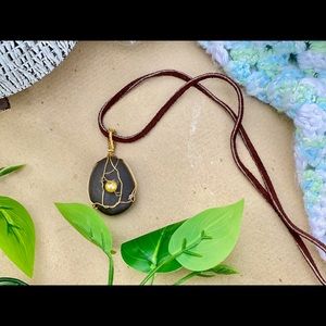 Egg in a nest wire wrapped pendant